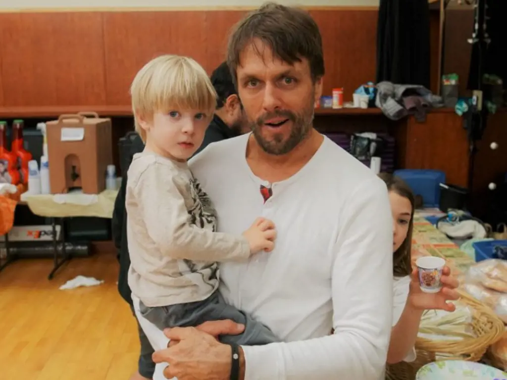 Jake Plummer posed with the little one for a photograph.