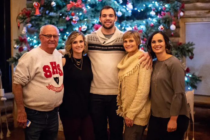 Dallas Goedert with his mom, stepdad, and two children celebrating Christmas