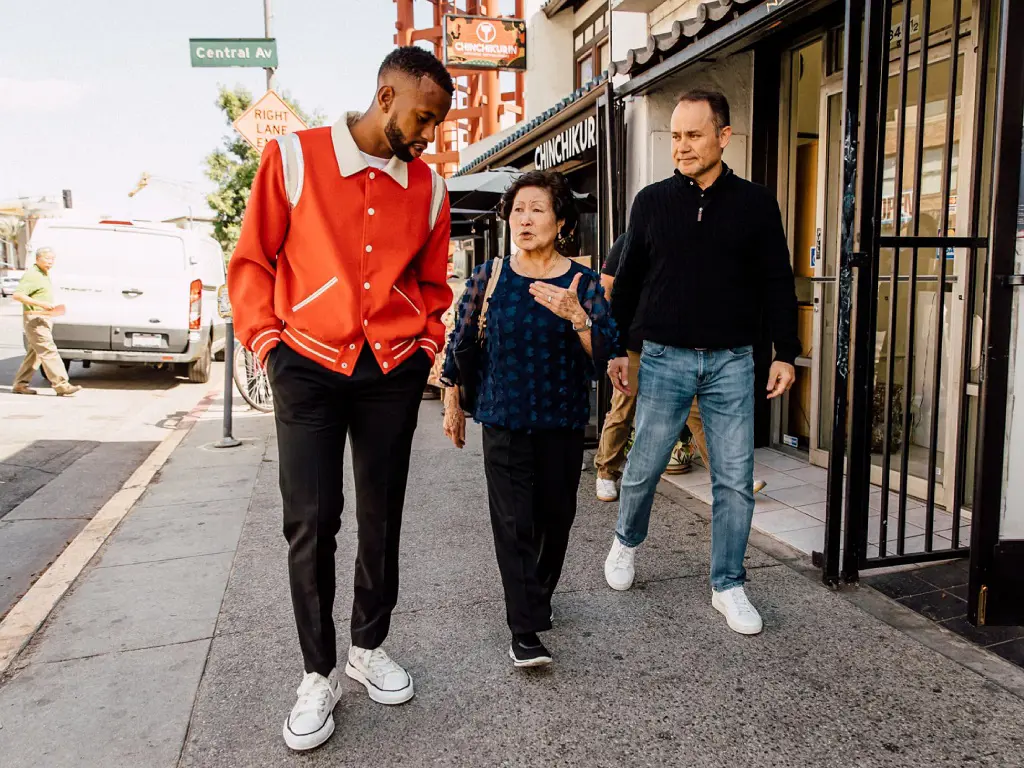 Kellyn Acosta walked down the streets of Tokyo with his dad and grandmother.