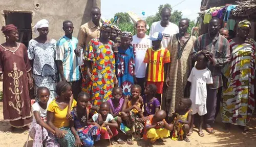 Mady Sissoko with his family and Michael Clayton(centre) in Mali