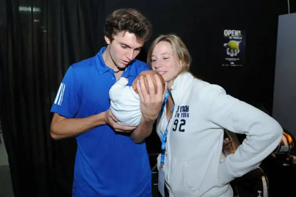Gilles Simon and his wife, Carine Lauret with their second-born son, Valentin