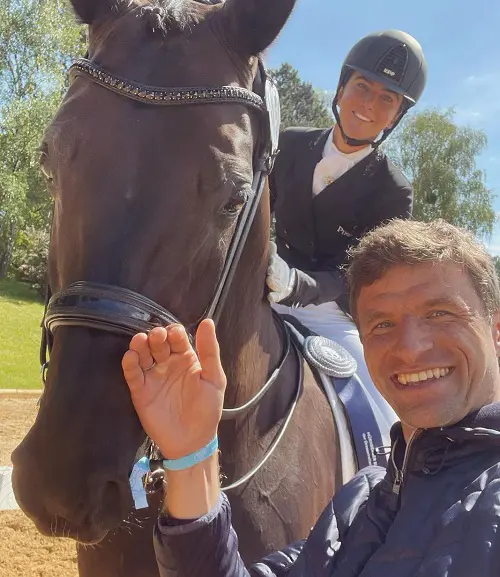 Thomas Muller clicks a selfie with his wife Lisa Muller and her horse Chucky earlier this year in May after she completes a practice session ahead of the Nurnberger Burg Pokal
