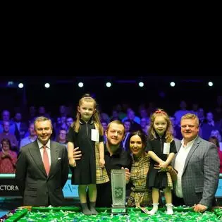 Mark and Aideen with their daughters as the snooker player wins the Northern Ireland Open in October 