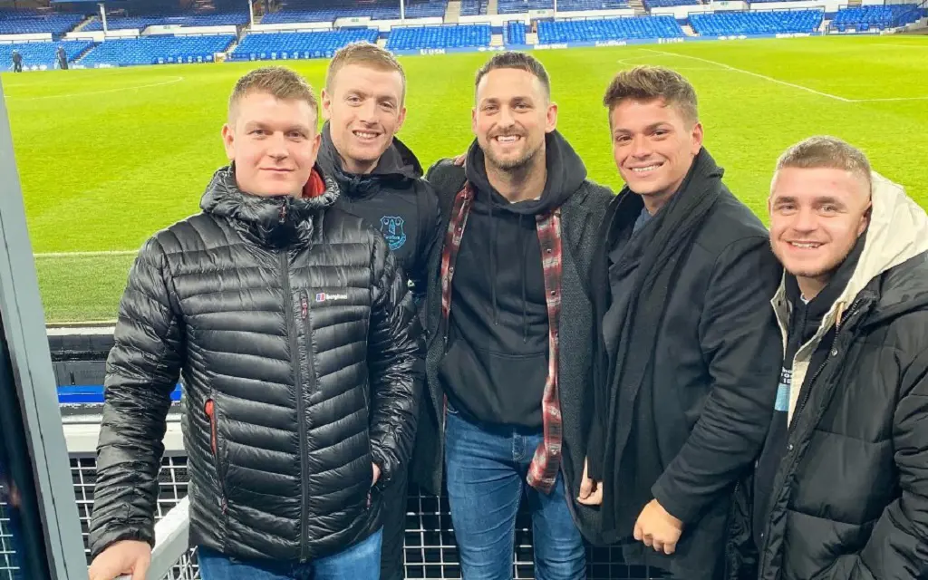 Jordan Pickford snapping picture with his brother Richard (in the middle) and others after an Everton game in 2019.