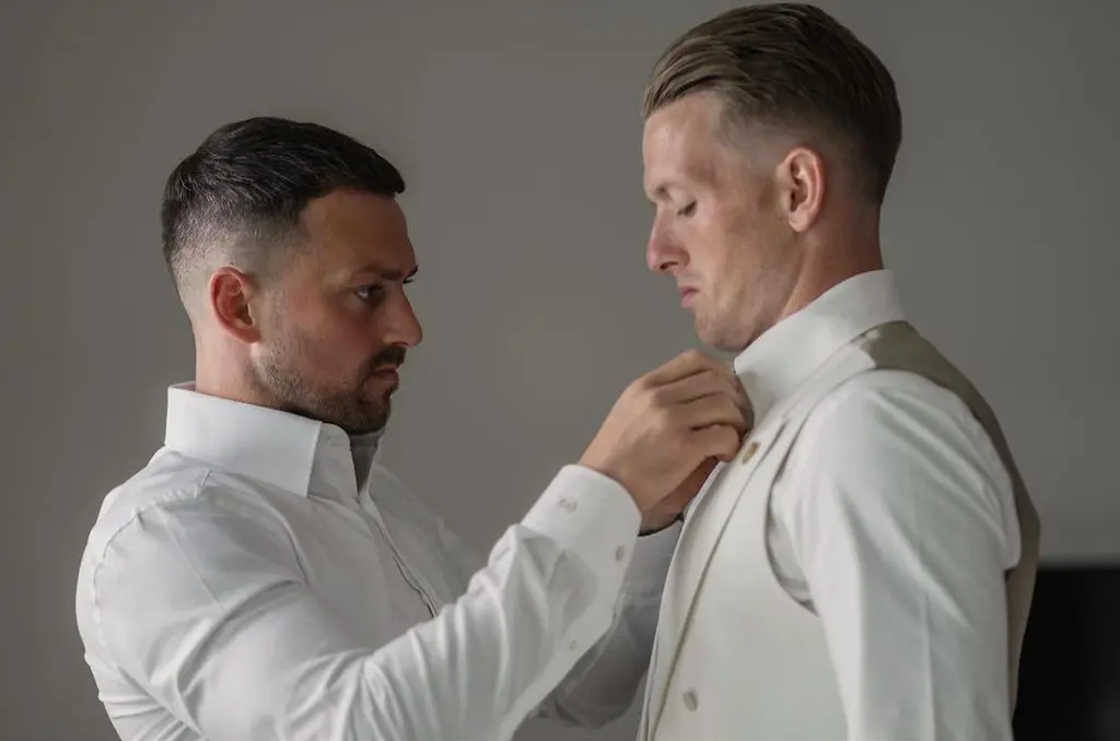 Jordan Pickford brother Richard helping him wear his wedding dress at his wedding in June 2022. The Everton goalkeeper married his love Megan Pickford. 