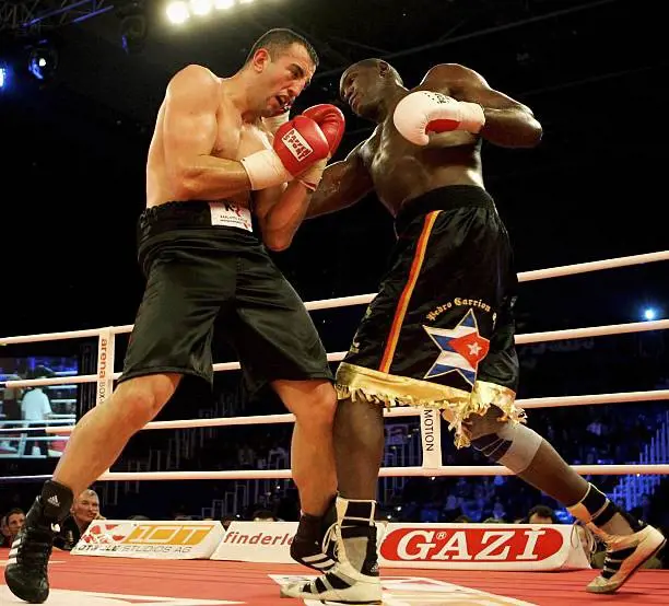  Pedro Carrion (R) of Germany punches Goran Gogic of Germany in the Heavyweight fight during the Arena Boxing Night at the Alterdorfer Sporthalle on December 15, 2006 in Hamburg, Germany. 