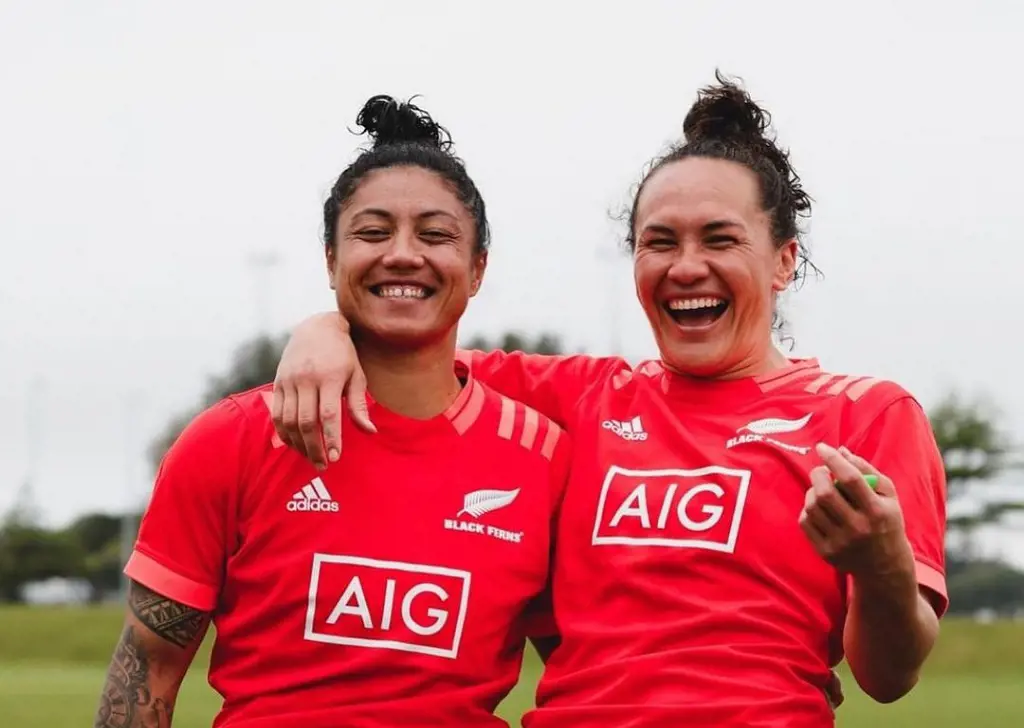 Portia Woodman and her partner Renee Wickliffe on their all red Ferns kit sharing a laugh on training in 2021.