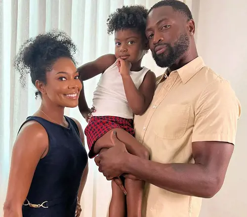 Kaavia Wade gives a cute pose with her parents Dwyane Wade and Gabriella Union 