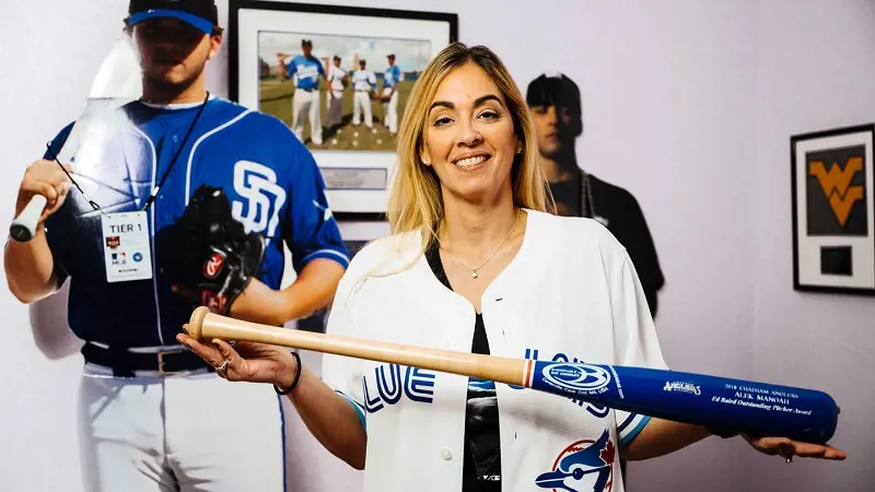 Alek Manoah's mom, Susana Lluch showing his baseball bat.