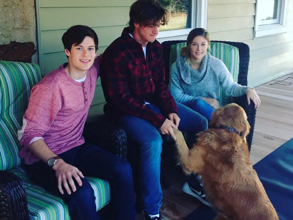 Tommy Paul and his siblings playing with their dog Kiya.