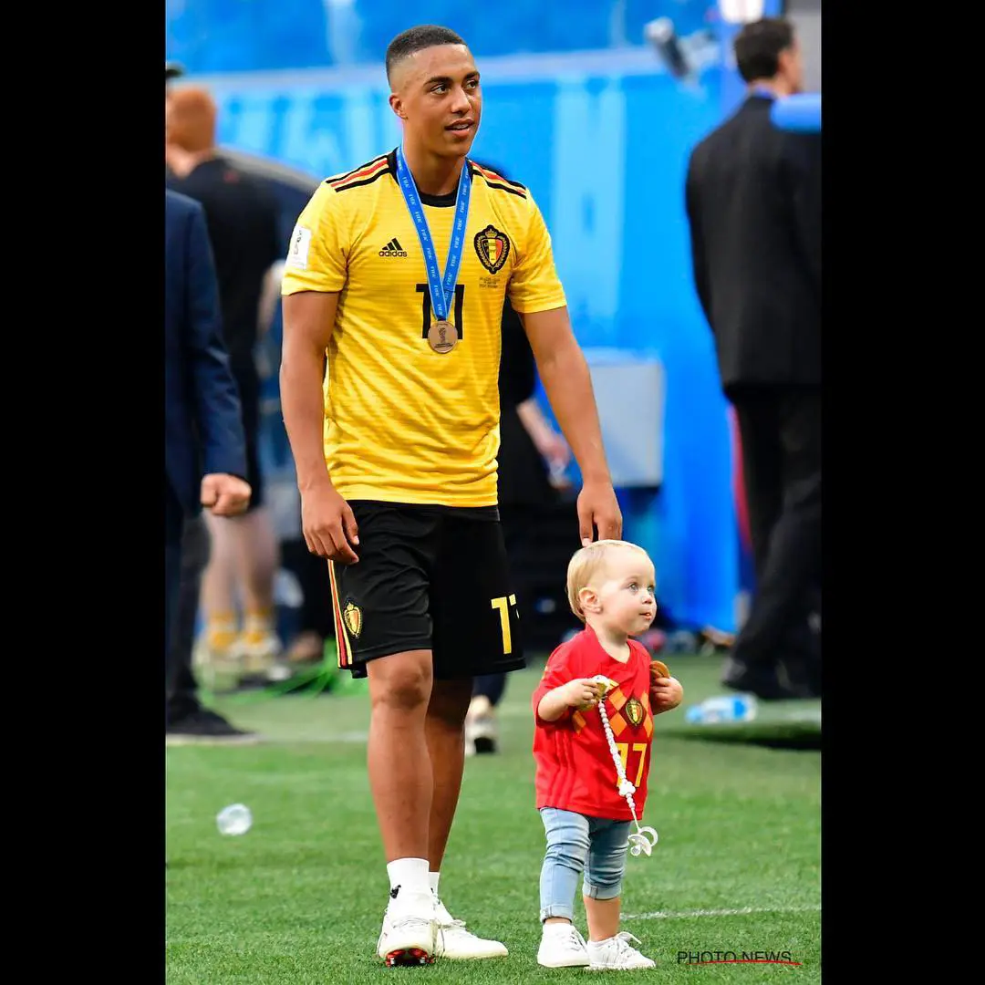 Youri Tielemans and his little daughter pictured walking in the field after a game.