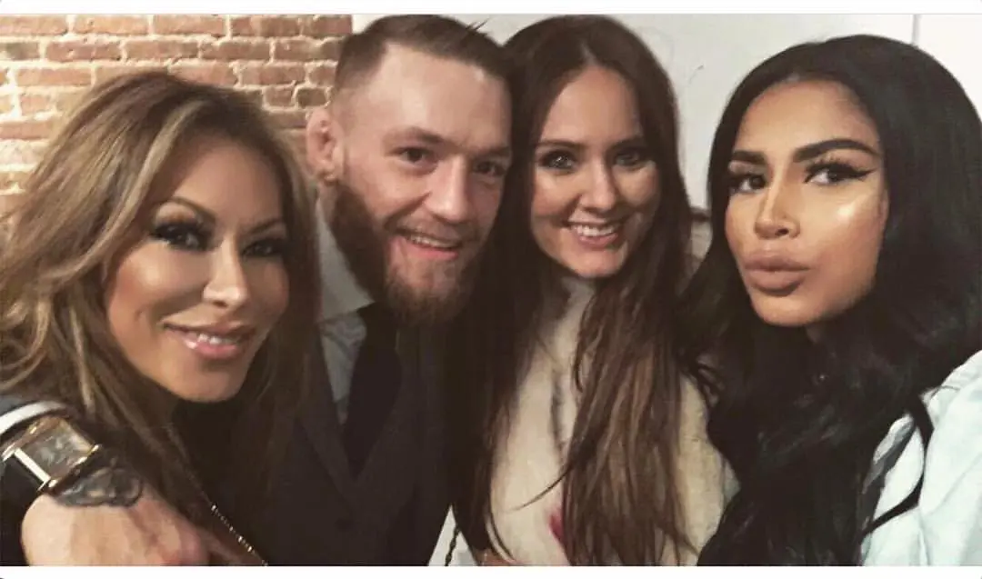 Nikki Danis(left) with Conor McGregor and his wife Dee Devlin(second from right) on October 7, 2018