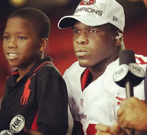Frank Gore Sr with his son Frank Gore Jr who was nine at the time in 2012 during a post match interview