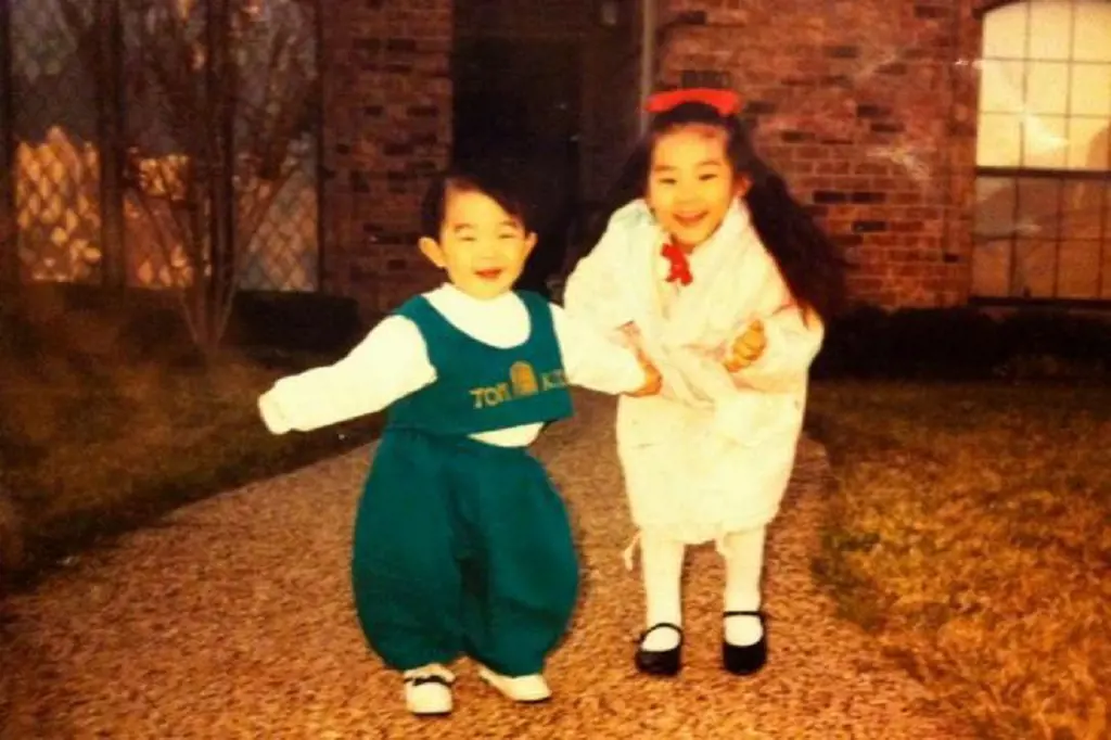 Arden Cho as a child with her brother