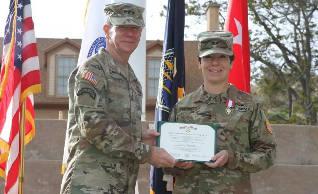 Maria Barrett accepting the Army Distinguished Service Medal