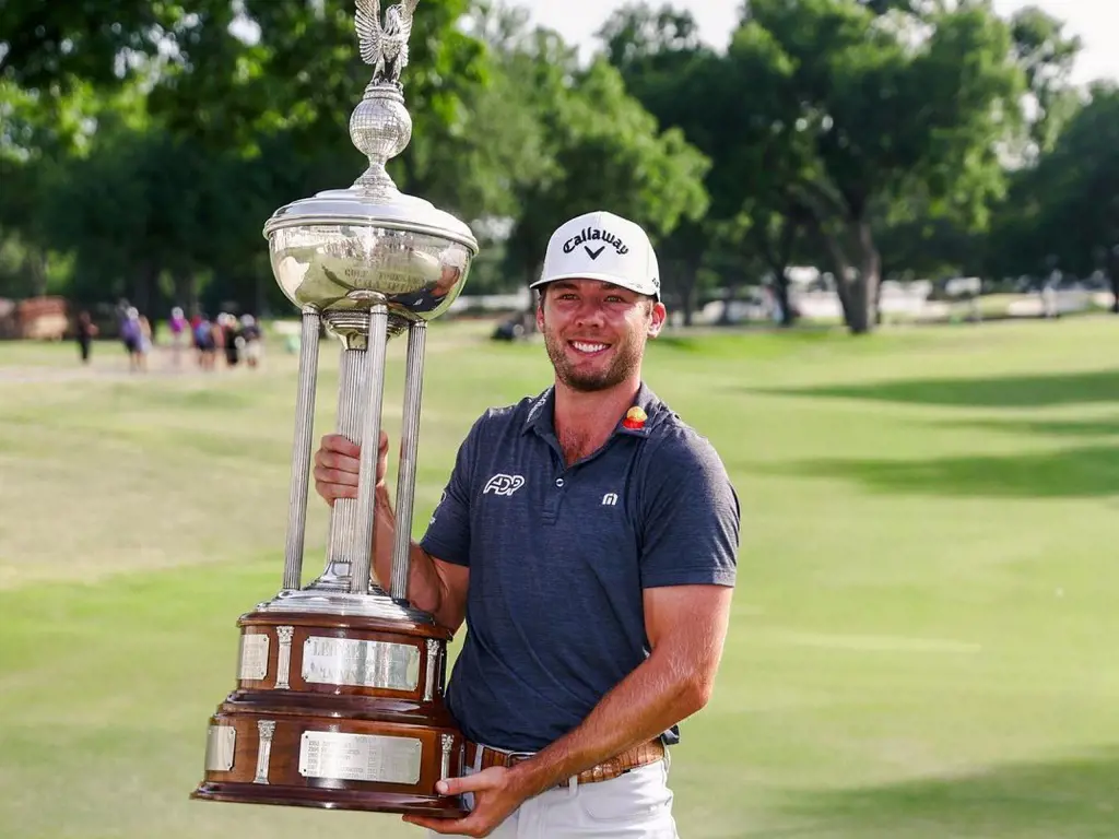 Sam Burns with the trophy he received by winning Charles Schwab Challenge in May 2022.