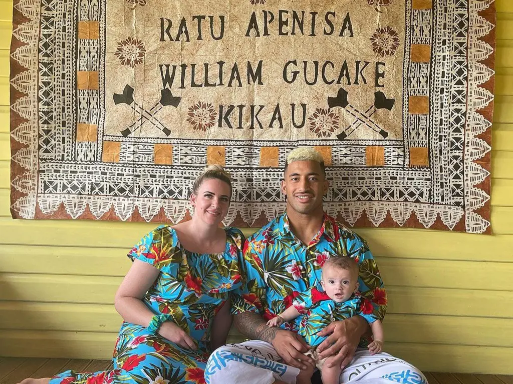 Viliame Kikau with his partner and their adorable son. 