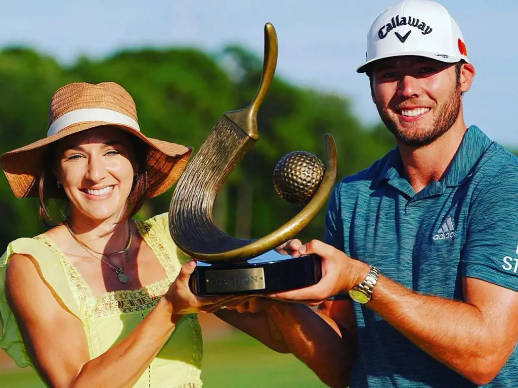 Sam Burns and his wife flaunting the trophy he won during his second Valspar Championship.