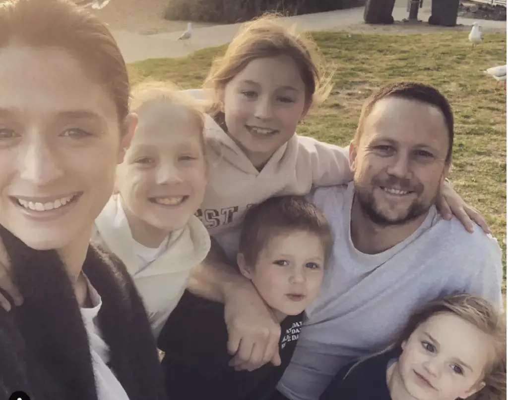  Nathan Brown with his wife and children