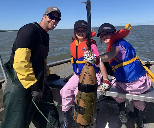 Kyle pictured fishing with his two daughters Kamryn and Khloe in 2021