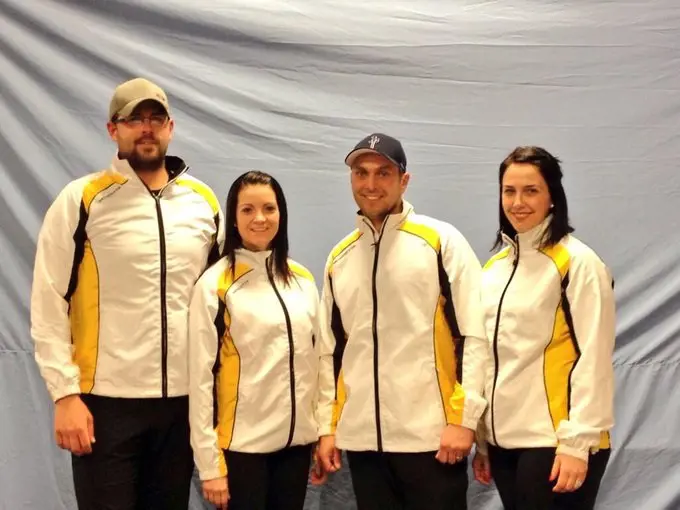 Kyle and Kerri pictured with their teammates as they win the Manitoba Mixed Championship in 2014