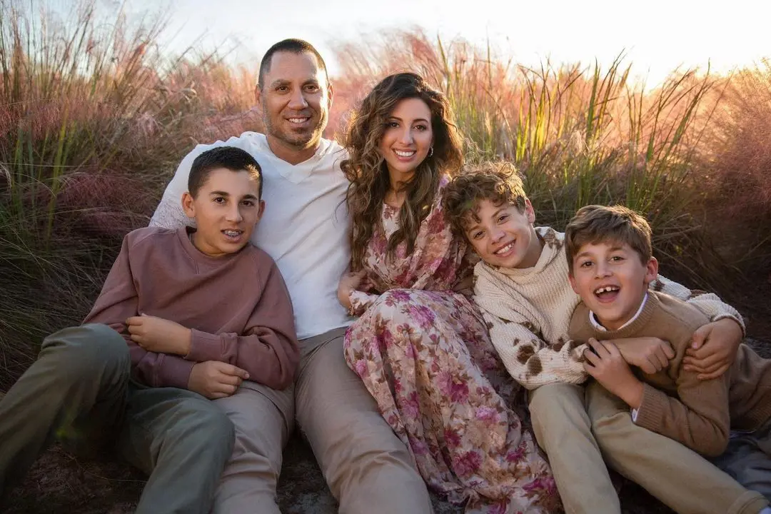 Travis with his partner Amy and three sons, Blake (on the left), Trip (fourth from left) and Knox (on the right).