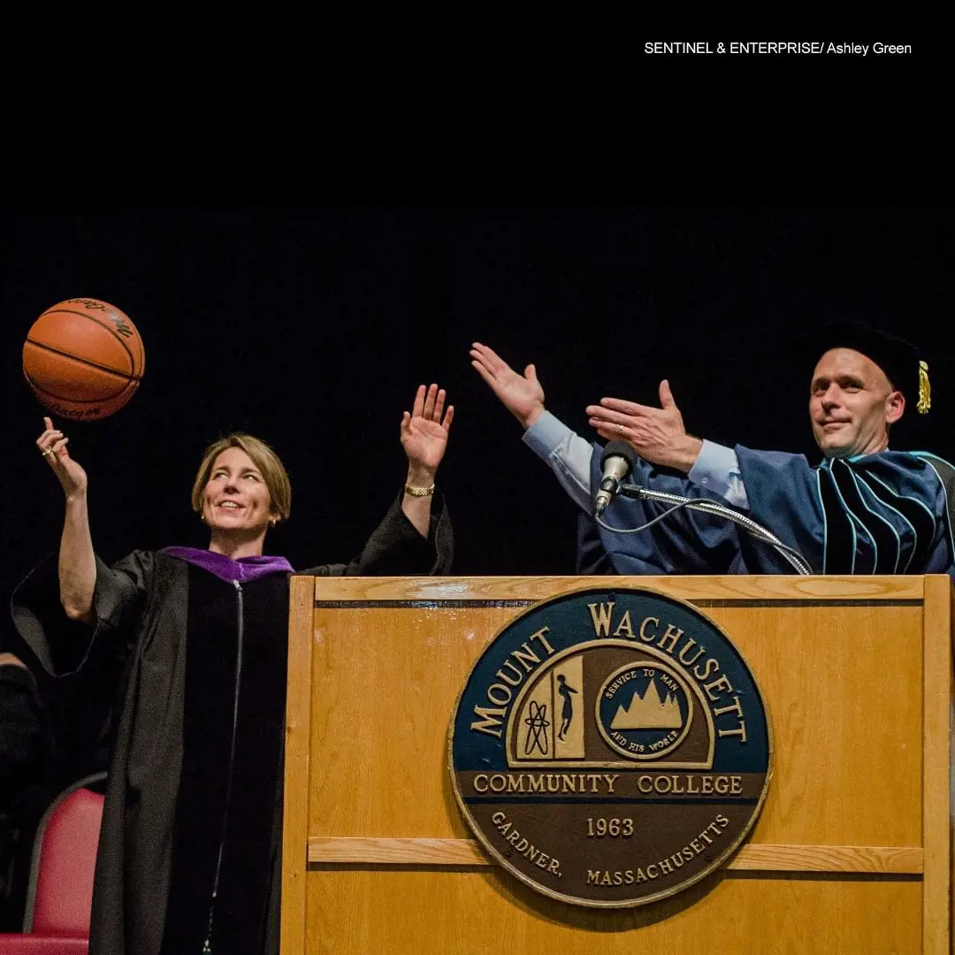 Maura Healey is introduced to the graduates of Mount Wachusett Community College students with a basketball in her hand in 2017