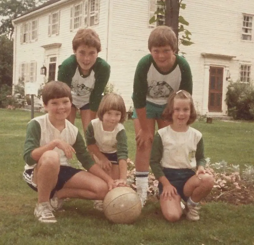 Maura Haley(top left) with her four younger siblings wearing Boston Celtics top are photographed by their mother