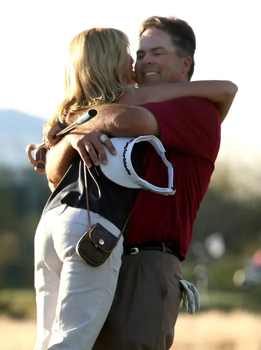 Kenny's partner hugs him after his win at the third playoff hole during the final round of the FBR Open in 2009